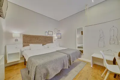 Cama o camas de una habitación en Pensión Mendi