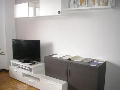 Una televisión o centro de entretenimiento en Pension Mayte