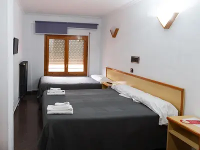Cama o camas de una habitación en Hostal Gabás