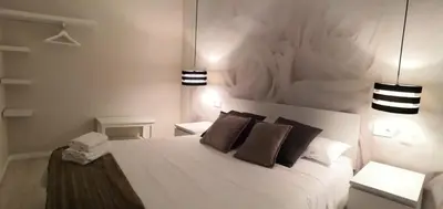 Cama o camas de una habitación en La Parada Santo Domingo 1