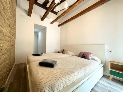 Cama o camas de una habitación en Dos Torres Rivendel - Vistas a la Basílica del Pilar