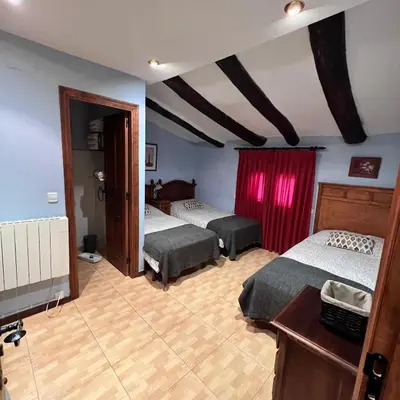 Cama o camas de una habitación en Posada Abadia de Sietamo