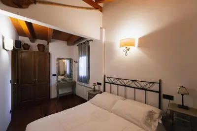 Cama o camas de una habitación en Ca l'Andreu