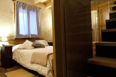 Cama o camas de una habitación en Casa Albana Pirineos