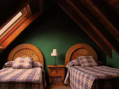 Cama o camas de una habitación en GRAN CHALET Hotel & Petit SPA