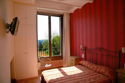Cama o camas de una habitación en Hostal La Fuente