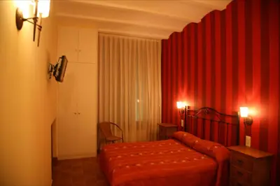 Cama o camas de una habitación en Hostal La Fuente