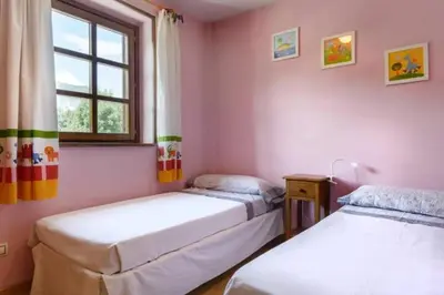 Cama o camas de una habitación en Unifamiliar El Pueyo de Jaca, Panticosa