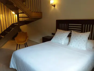 Cama o camas de una habitación en Les Flors - Hotel Rural & Cabanyes