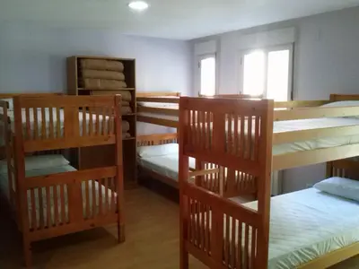 Cama o camas de una habitación en Albergue Turístico Rio Aragon