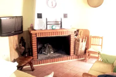 Una televisión o centro de entretenimiento en Charming House in Orés