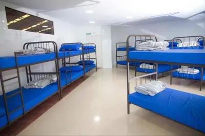 Cama o camas de una habitación en Albergue de peregrinos San Cipriano