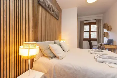 Cama o camas de una habitación en El Escondite de Biescas