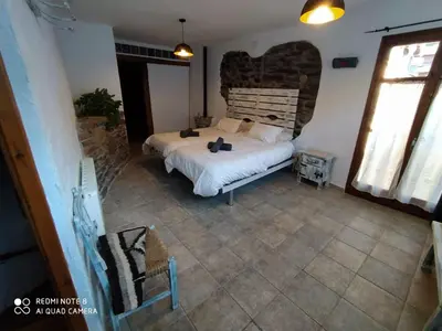 Cama o camas de una habitación en Cal Jardiner