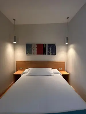 Cama o camas de una habitación en Hostal Aralar