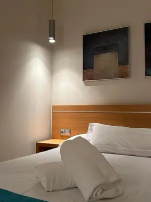 Cama o camas de una habitación en Hostal Aralar