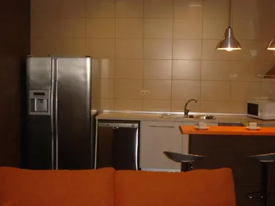 Una cocina o zona de cocina en Apartamentos La Muralla