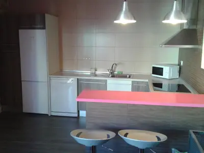 Una cocina o zona de cocina en Apartamentos La Muralla