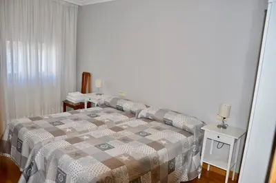 Cama o camas de una habitación en Apartamentos Montejurra