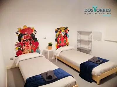 Cama o camas de una habitación en Dos Torres Bilbo Puerta del Carmen