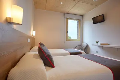 Cama o camas de una habitación en Hostal Nobadis
