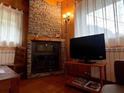 Una televisión o centro de entretenimiento en Casa Franch - L'Amfitriona