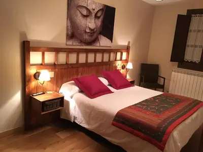 Cama o camas de una habitación en Hostal Otsoa