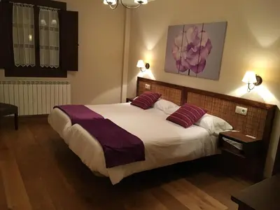 Cama o camas de una habitación en Hostal Otsoa