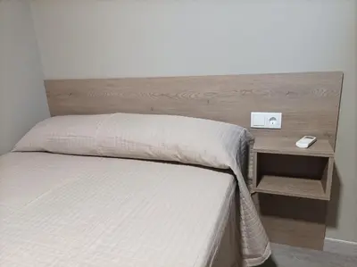 Cama o camas de una habitación en Hotel Balfagón
