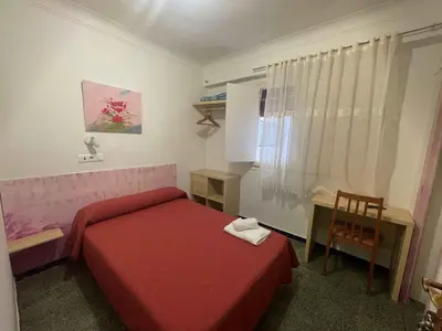 Cama o camas de una habitación en Hostal Cumbre