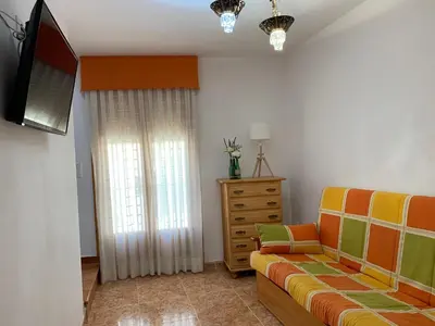 Una televisión o centro de entretenimiento en Casa Rural Arenal