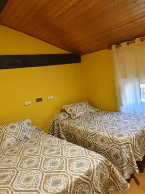 Cama o camas de una habitación en Hostal Rural Oricáin