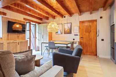 Una televisión o centro de entretenimiento en Luderna - Apartamento con jardín Pleta de Arties Montardo