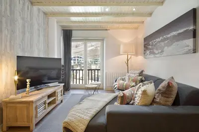 Una televisión o centro de entretenimiento en Luderna - Apartamento Mirador de Aran