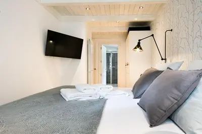 Una televisión o centro de entretenimiento en Luderna - Apartamento Val de Ruda A17 era Cabana