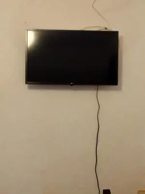 Una televisión o centro de entretenimiento en Casa la Era