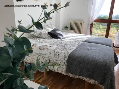 Cama o camas de una habitación en Apartamento Turístico El Enclave