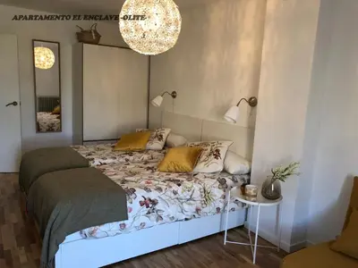 Cama o camas de una habitación en Apartamento Turístico El Enclave