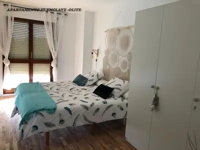 Cama o camas de una habitación en Apartamento Turístico El Enclave