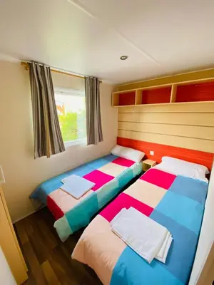 Cama o camas de una habitación en Camping Oliana