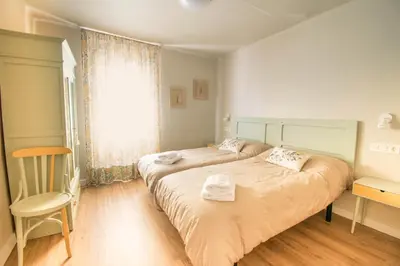Cama o camas de una habitación en Preciosa casa para familias y grupos en Navarra