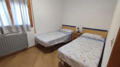Cama o camas de una habitación en Biescas Doctor Fleming reg VU-HU-19-226