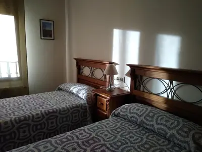 Cama o camas de una habitación en Apartamentos Aires de Guara