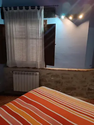 Cama o camas de una habitación en APARTAMENTOS MATARRANYA
