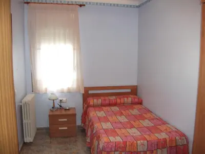 Cama o camas de una habitación en Hostal Oasis