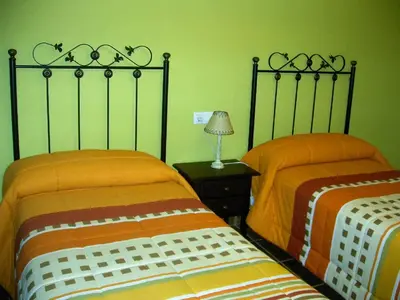 Cama o camas de una habitación en Apartamentos Arcos de Solana
