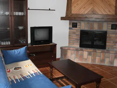 Una televisión o centro de entretenimiento en Apartamentos Arcos de Solana