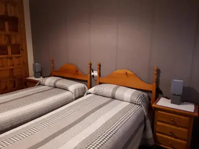 Cama o camas de una habitación en Apartamento Sallan Ainsa Ordesa Zona Zero