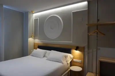 Cama o camas de una habitación en Habital Suites