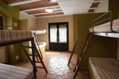 Cama o camas de una habitación en Albergue Rural de Guara